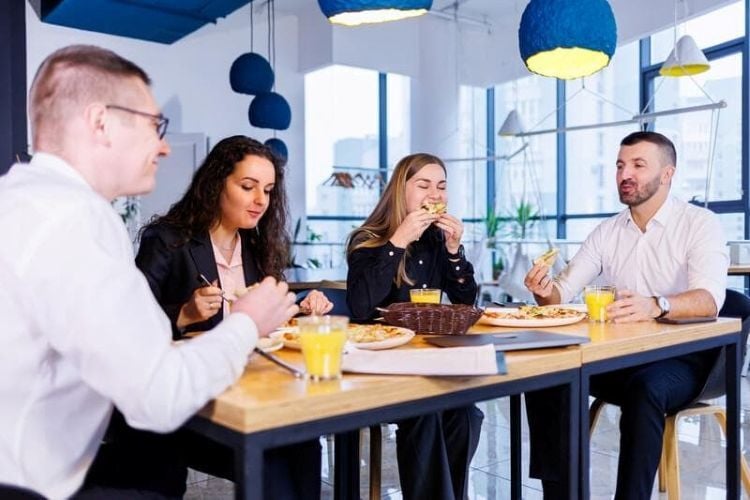 UK-blog-Colleagues-having-lunch-at-a-cafeteria